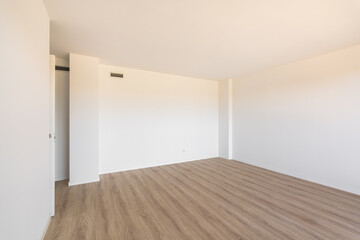 Wide spacious room with walls and ceiling painted in one color. On the floor there is a laminate of high quality and expensive wood. Room for bedroom or living room with good natural lighting.