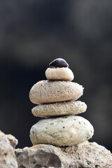 Piles of stones on the beach with a blurred background