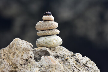 Piles of stones on the beach with a blurred background