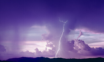 Dramatic sky with lightning at sunset
