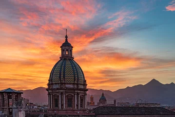 Fotobehang The sun sets behind the dome of the Theatines church, city of Palermo IT © Davide D. Phstock