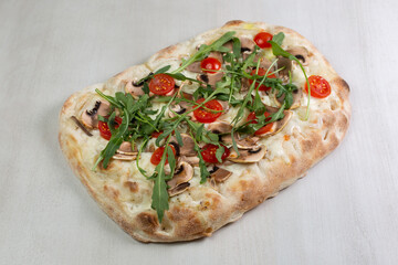 pizza with tomatoes and mushrooms