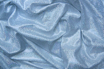  Light blue laminated and iridescent, elegant lycra fabric. Wavy drappe with glitter and...