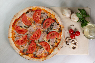 pizza with tomatoes and mushrooms