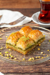 Turkish pistachio baklava. Turkish cuisine delicacies. Baklava on wood background. close up