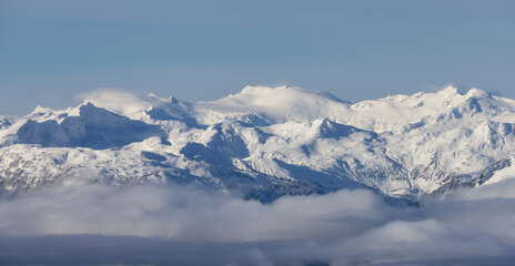 Snow and Cloud covered Canadian Nature Landscape Background. Winter Season in Whistler, British Columbia, Canada. From Blackcomb Mountain