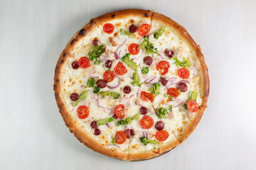 pizza with salami and tomatoes