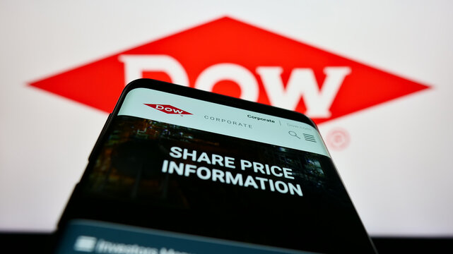 Stuttgart, Germany - 01-27-2023: Mobile phone with web page of American chemical company Dow Inc. on screen in front of business logo. Focus on top-left of phone display.