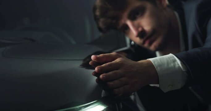 Portrait Close Up of a Young Businessman Checking and Admiring the Details of his Newly Bought Car. Engineer Presenting a Perfectly Designed Vehicle. Concept of Sales, Advertising, Marketing for Cars