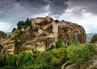 Amazing panoramic landscape of monastery on a rock. The Monastery of Great Meteoron is an Eastern Orthodox monastery. Meteora monastery complex. Thessaly. Greece. UNESCO World Heritage List.