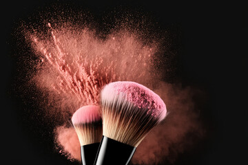 Makeup Brushes with Pink Powder Explosion on Black Background