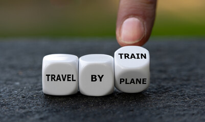 Hand turns dice and changes the expression 'travel by plane' to 'travel by train'. Symbol for...