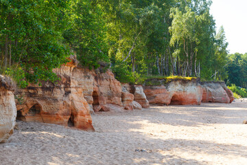 Veczemju klintis (Veczemju cliffs) on Baltic sea near Tuja, Latvia in summer season. Beautiful sea shore with limestone and sand caves - obrazy, fototapety, plakaty