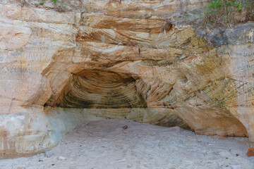 Veczemju klintis (Veczemju cliffs) on Baltic sea near Tuja, Latvia in summer season. Beautiful sea shore with limestone and sand caves