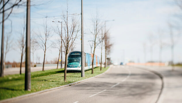 Strasbourg, France - Mar 28, 2015: Tilt-shift lens view of new tramway operated by CTS in motion near Rhenus Sport arena in Strasbourg