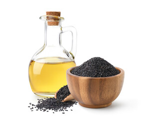Sesame oil with black sesame in wooden bowl and scoop isolate on white background.