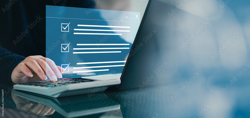Poster  Checklist on Digital system. Digital work checklist on virtual screen concept, Businessman use a pen point on checklist and use laptop working in office Document Management. efficiently manage file.