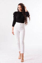 photo session of a young brunette model in photo studio on white background