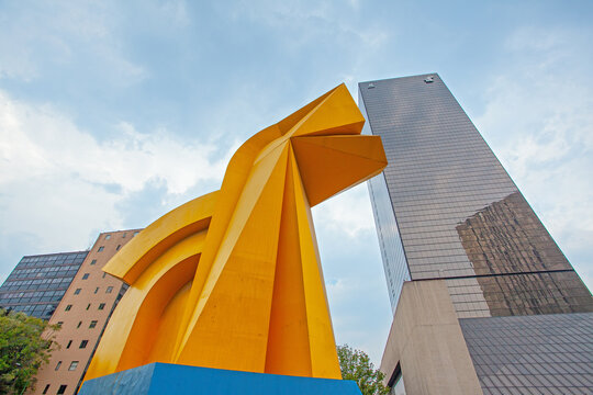 Mexico City, Mexico - Aprill 15, 2022: Torre del Caballito Skyscraper and Caballito sculpture (rocking horse) in Paseo de la Reforma, Mexico City.