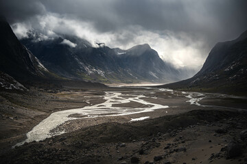 Hiking in wild, remote arctic valley of Akshayuk Pass, Baffin Island, Canada