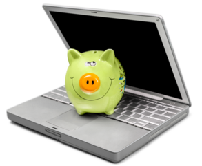 Piggy Bank on Laptop Keyboard