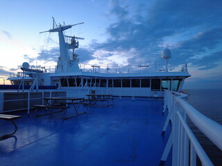 Rear view of the navigation control cabin on a passenger ship at summer evening with blue sky background © Dylan
