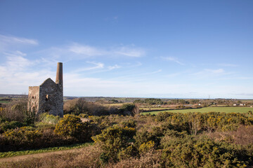 The buildings at the site of Wheal Peevor - a tin mine in Redruth, Cornwall UK.