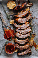 Smoked BBQ Ribs from a summer barbecue in nature.