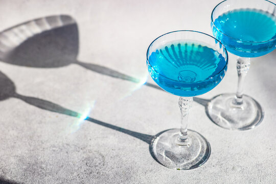 Close-up of two blue cocktails on a table