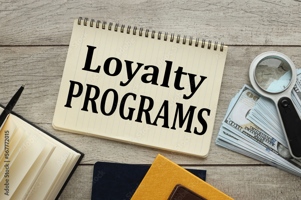 Poster text on notepad with spring. near the magnifying glass and glasses loyalty program