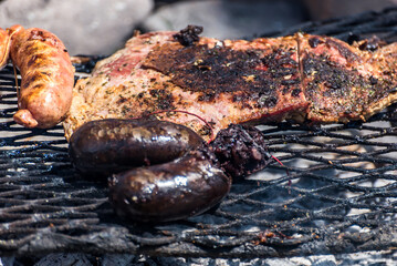 typical argentinean food, cooking with brazas, grilled meat, chorizo and black pudding