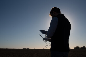 silhouette of person with laptop