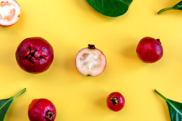 Red Cattley guava (Psidium cattleyanum) fruit and leaves