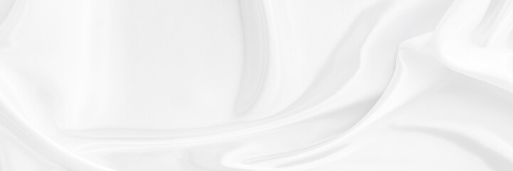 White gray satin texture that is white silver fabric silk panorama background with beautiful soft...