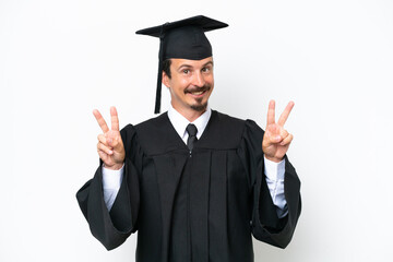Young university graduate man isolated on white background showing victory sign with both hands