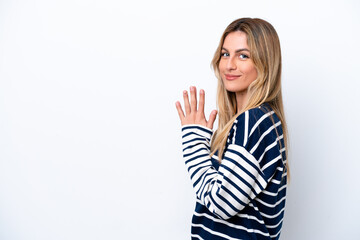 Young Uruguayan woman isolated on white background scheming something