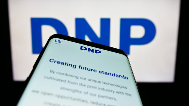 Stuttgart, Germany - 01-28-2023: Mobile phone with website of Japanese company Dai Nippon Printing Co. Ltd. on screen in front of logo. Focus on top-left of phone display.