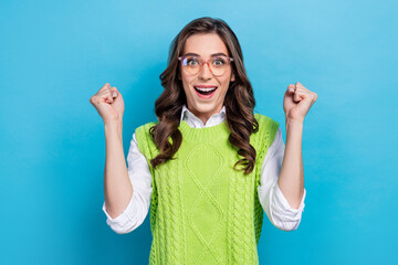 Photo portrait of pretty young girl eyeglasses raise fists celebrate promotion wear trendy green...
