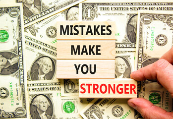 Mistake make stronger symbol. Concept words Mistakes make you stronger on wooden blocks. Beautiful...