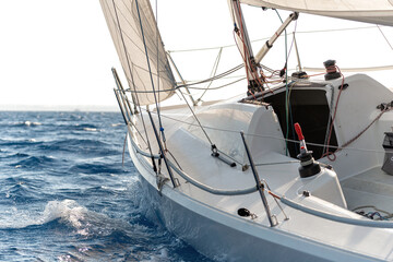 Close-up of sailing yacht in a rough sea