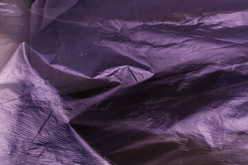 texture of crumpled purple polyethylene background