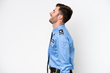 Young police caucasian man isolated on white background laughing in lateral position