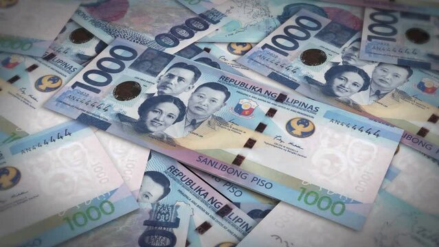 Pile of philippines peso cash money, inflation concept. Closeup new philippines one thousand peso bills 4k resolution
