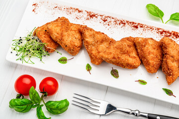 Homemade chicken nuggets on white background