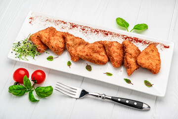 Homemade chicken nuggets on white background