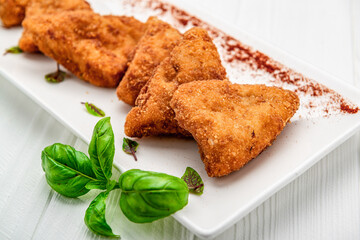 Homemade chicken nuggets on white background