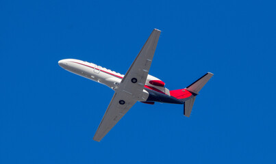 Airplane isolated on blue sky background