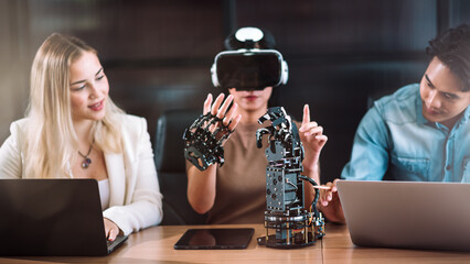 Female and male robotic engineer learning with specialish, student discuss and working with blueprint and coding program for robot arm. Technology and innovation concept.