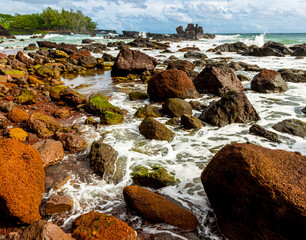 Waves Washing Over The Red Rocks Of Koki Beach at Koki Beach Park, Hana, Maui, Hawaii, USA