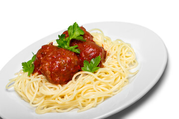 Spaghetti pasta with tomatoes and parsley on plate